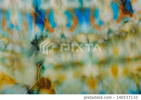 abstract pattern on silk fabric texture in blue, yellow, green colors 140537110