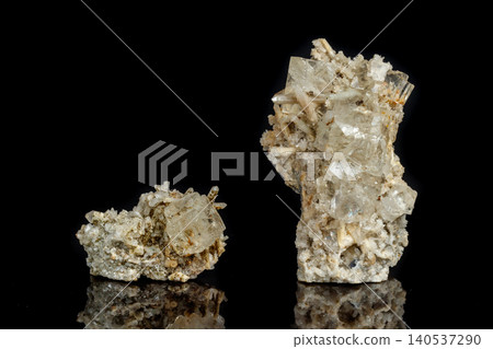 Macro mineral stone fluorite with quartz against black background Macro mineral stone fluorite with quartz against black background 140537290
