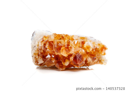 Macro mineral stone Citrine in rock in crystals on a white background Macro mineral stone Citrine in rock in crystals on a white background 140537328