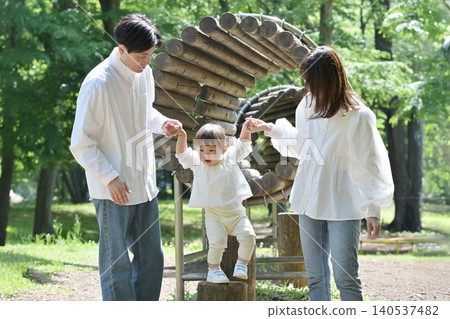 A family enjoying the athletic tunnel in the park. A family enjoying the athletic tunnel in the park. 140537482