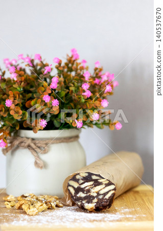 Chocolate salami sausage on wooden board 140537670