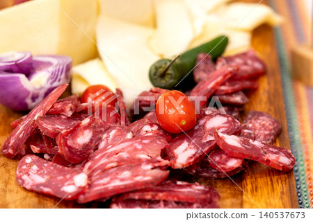 Sliced salami and cheese platter Sliced salami and cheese platter 140537673