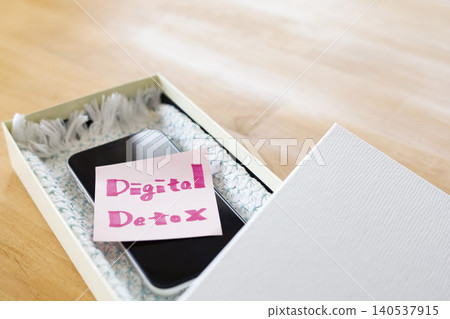 Image material for digital detox by putting your smartphone in a box. Image material for digital detox by putting your smartphone in a box. 140537915
