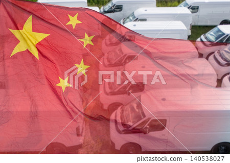 Chinese flag with a fleet of electric commercial vans in the background 140538027