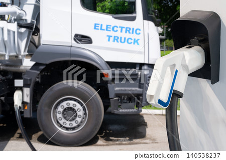 Electric truck batteries are charged from the charging station. Concept. Electric truck batteries are charged from the charging station. Concept. 140538237