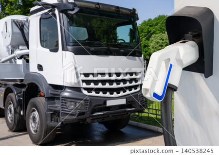 Electric vehicles charging station on a background of a truck. 140538245