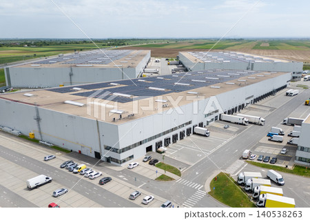 Logistics centers with solar panels on roofs. Aerial view. Logistics centers with solar panels on roofs. Aerial view. 140538263