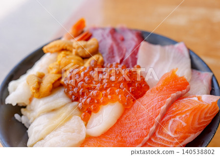 A luxurious seafood bowl featuring fresh seafood from Hokkaido. A luxurious seafood bowl featuring fresh seafood from Hokkaido. 140538802