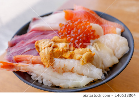 A luxurious seafood bowl featuring fresh seafood from Hokkaido. A luxurious seafood bowl featuring fresh seafood from Hokkaido. 140538804