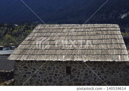 weathered roof features traditional wooden shingles 140539614