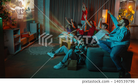 Big family watching American football projection at home with cheering children. Big family watching American football projection at home with cheering children. 140539796