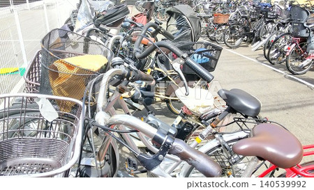 Bicycles lined up in the bicycle parking lot Bicycles lined up in the bicycle parking lot 140539992