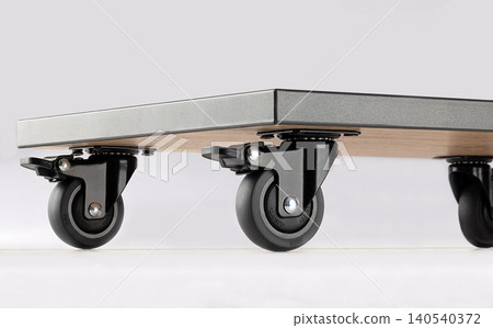 Wooden cart with wheels for easy movement in office or home setup Wooden cart with wheels for easy movement in office or home setup 140540372
