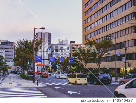 Autumn street trees and the streetscape at a crossroads at dusk. Autumn street trees and the streetscape at a crossroads at dusk. 140540427