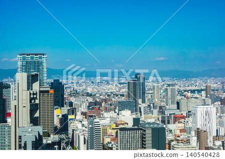 A panoramic view of the city, with distant mountain ranges and clusters of skyscrapers. A panoramic view of the city, with distant mountain ranges and clusters of skyscrapers. 140540428