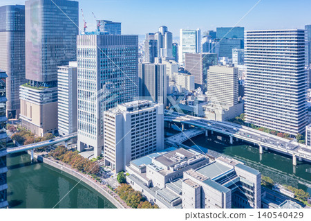A panoramic view of the cluster of skyscrapers lining the river and the urban infrastructure. A panoramic view of the cluster of skyscrapers lining the river and the urban infrastructure. 140540429