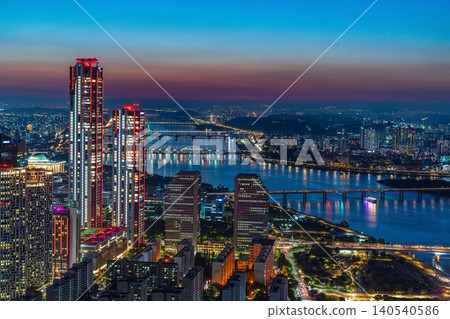High-angle panoramic view of Yeouido financial district skyscrapers at sunset in Seoul, South Korea. High-angle panoramic view of Yeouido financial district skyscrapers at sunset in Seoul, South Korea. 140540586