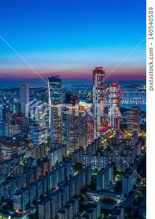 High-angle panoramic view of Yeouido financial district skyscrapers at sunset in Seoul, South Korea. High-angle panoramic view of Yeouido financial district skyscrapers at sunset in Seoul, South Korea. 140540589