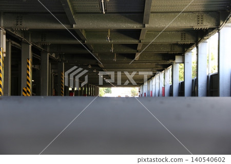 A passageway in an unmanned multi-story parking garage 140540602
