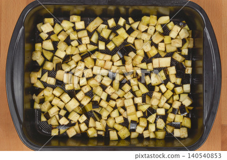 Diced eggplant coated in olive oil, salt, and pepper Diced eggplant coated in olive oil, salt, and pepper 140540853