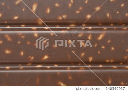 Milk chocolate texture with puffed rice 140540937