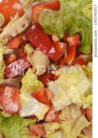 Fresh tomato and lettuce salad texture close up Fresh tomato and lettuce salad texture close up 140540957