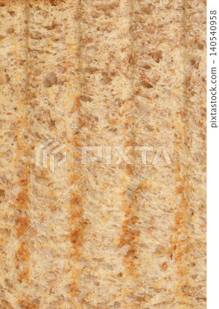 Toasted whole wheat bread slice surface close up Toasted whole wheat bread slice surface close up 140540958