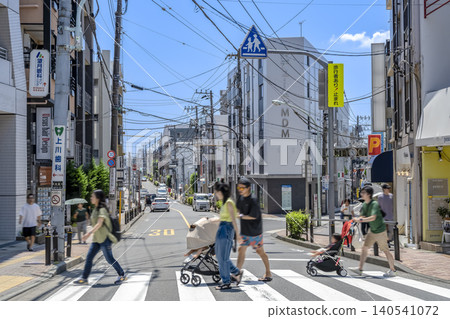 Urban landscape of Setagaya Ward, Tokyo: People passing by in front of Okusawa Station. Urban landscape of Setagaya Ward, Tokyo: People passing by in front of Okusawa Station. 140541072
