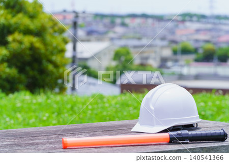 Helmet and traffic wand | Construction industry, security guard, guardman image Helmet and traffic wand | Construction industry, security guard, guardman image 140541366