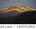 Morning glow at Ichinose Park in Norikura Highlands; a view of Mount Norikura from Maime Pond. 140541862