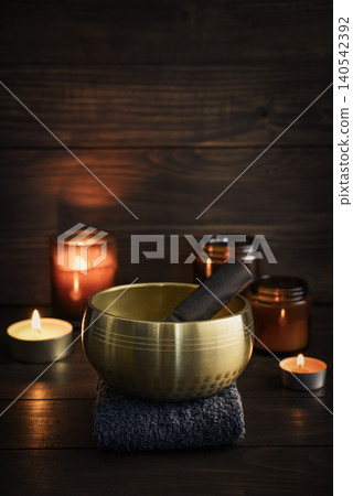 A calming wellness scene featuring a singing bowl A calming wellness scene featuring a singing bowl 140542392