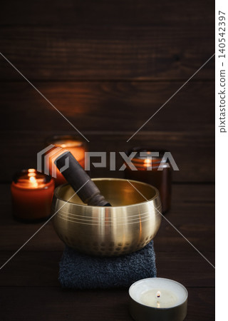 A calming wellness scene featuring a singing bowl A calming wellness scene featuring a singing bowl 140542397