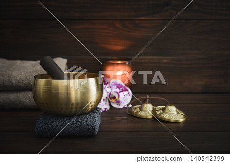 A calming wellness scene featuring a singing bowl A calming wellness scene featuring a singing bowl 140542399