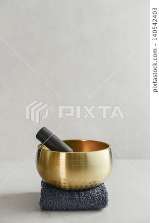 A bright, minimal wellness composition featuring a singing bowl A bright, minimal wellness composition featuring a singing bowl 140542403