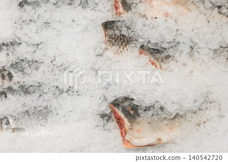 Raw frozen fish cold ice fresh seafood supermarket counter sea food Raw frozen fish cold ice fresh seafood supermarket counter sea food 140542720