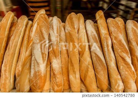 Fresh baked goods bakery loaf baguette bread wheat food background Fresh baked goods bakery loaf baguette bread wheat food background 140542780