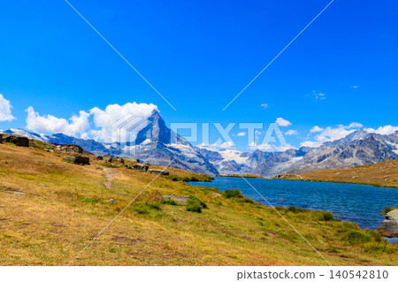 View of Stelli Lake (Stellisee) and Matterhorn mountain at summer in Zermatt, Swiss Alps, Switzerland View of Stelli Lake (Stellisee) and Matterhorn mountain at summer in Zermatt, Swiss Alps, Switzerland 140542810