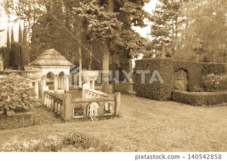 Stone crosses and tombstones in a cemetery. Black and white toned Stone crosses and tombstones in a cemetery. Black and white toned 140542858