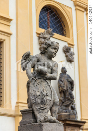 Baroque statue before facade Loreta Monastery in Prague, Czech Republic 140542924