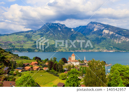 Aerial view of Spiez town with Spiez castle and Lake Thun in the Bernese Oberland, Switzerland Aerial view of Spiez town with Spiez castle and Lake Thun in the Bernese Oberland, Switzerland 140542957