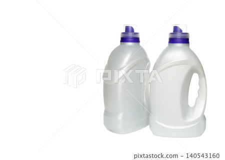 two canisters of household chemicals with purple caps shifted to the right side of white background two canisters of household chemicals with purple caps shifted to the right side of white background 140543160