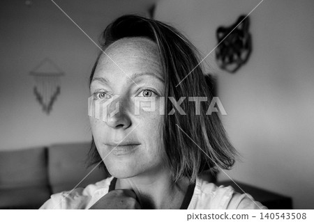 Contemplative Woman in Black and White Close-Up Contemplative Woman in Black and White Close-Up 140543508
