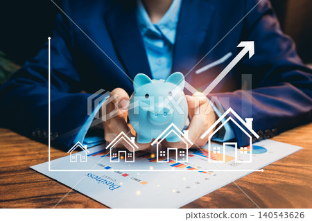 Saving concept. Financial Growth Concept with Piggy Bank and House Graph Representation for Investment Planning Saving concept. Financial Growth Concept with Piggy Bank and House Graph Representation for Investment Planning 140543626