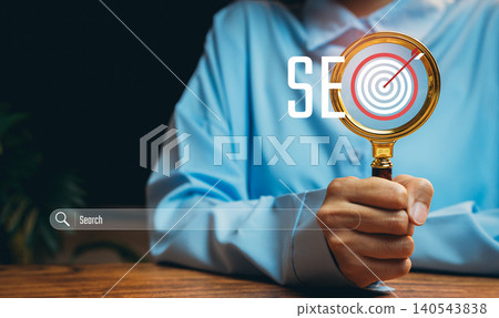 Search optimization concept. Hand holding magnifier with target icon, SEO strategy, data research, digital marketing analysis, online visibility, performance tracking, business growth. Search optimization concept. Hand holding magnifier with target icon, SEO strategy, data research, digital marketing analysis, online visibility, performance tracking, business growth. 140543838