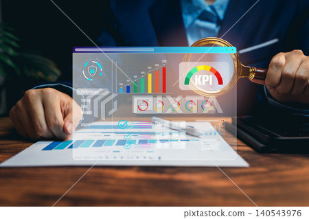 Hand with magnifying glass checking KPI dashboard, performance measurement insight, business analytics evaluation, strategic planning workflow, long-term growth improvement, KPI concept 140543976