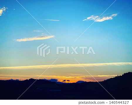 Airplane clouds and sunset 140544327