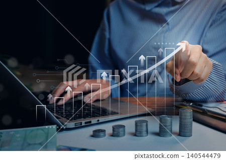 Business growth. Digital investment growth, person using laptop with rising financial chart and stacked coins, online business strategy and economic success Business growth. Digital investment growth, person using laptop with rising financial chart and stacked coins, online business strategy and economic success 140544479