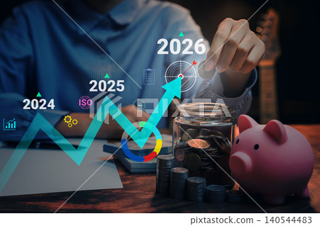 2026 Business concept. Financial growth forecast, person saving coins with piggy bank and future investment chart, wealth planning and long term business strategy 2026 Business concept. Financial growth forecast, person saving coins with piggy bank and future investment chart, wealth planning and long term business strategy 140544483