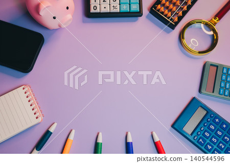 Business flat lay. Colorful Office Supplies and Tools for Personal Finance Management on a Vibrant Background 140544596