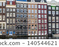 Amsterdam canal water old colored houses in row. City center building architecture street. Amsterdam, Netherlands 140544621